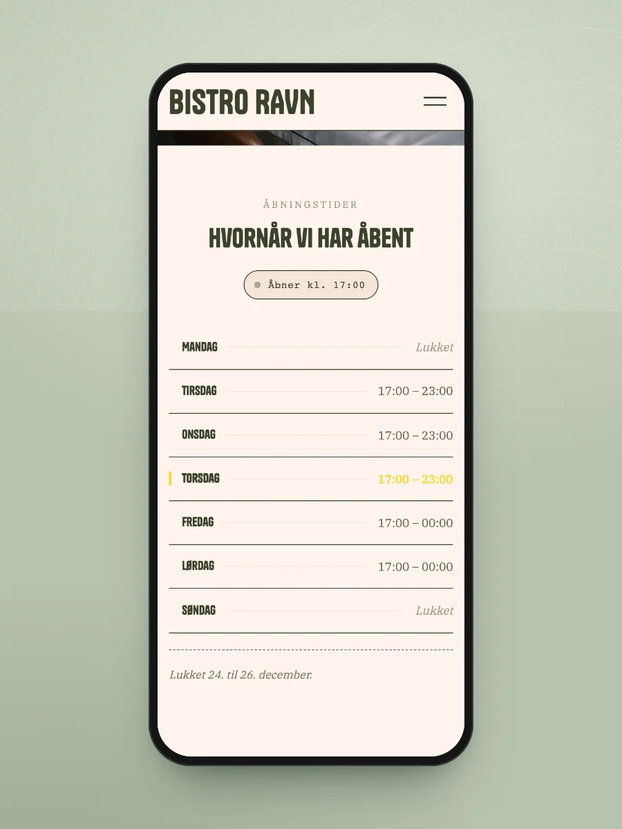 Åbningstider på en mobil: lukket mandag og søndag, åbent tirsdag til lørdag fra 17.00, dagen i dag fremhævet og en note om julen